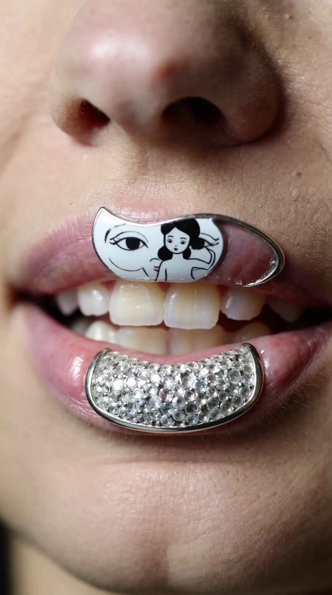 A close-up editorial photograph of a person's slightly parted lips, revealing