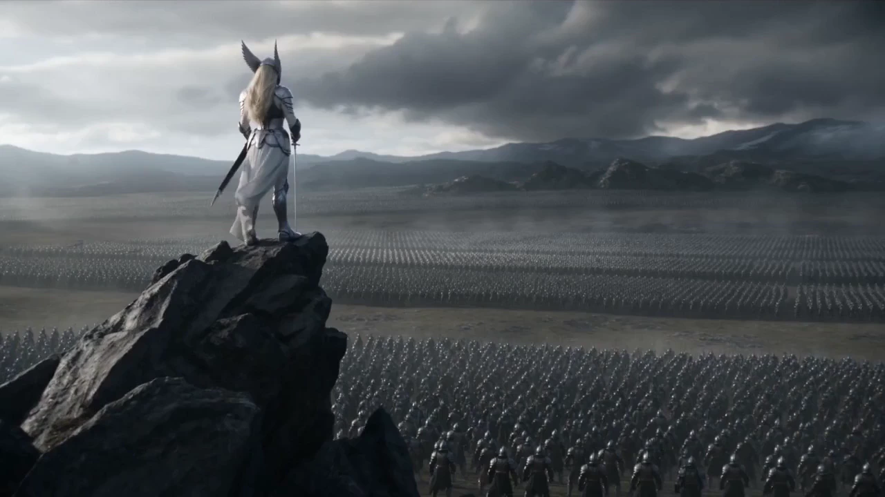 Shot 1 Subject: A female warrior standing on jagged rocks overlooking a