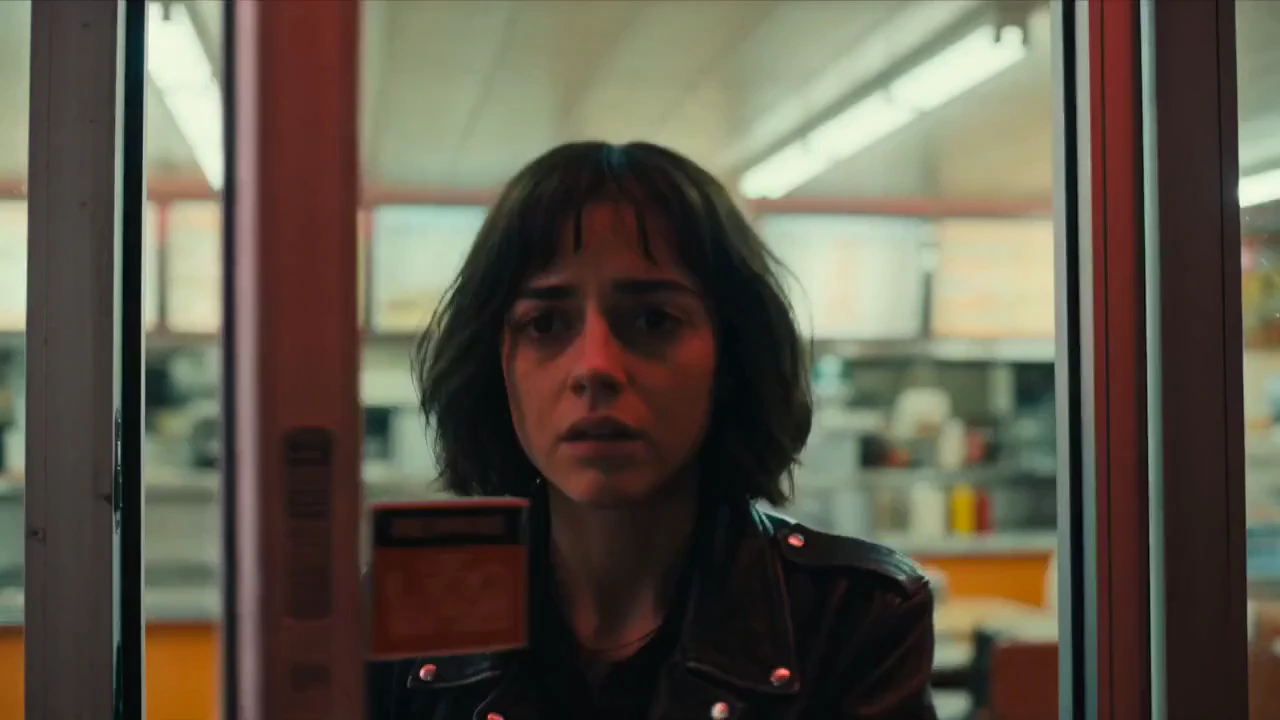 Cinematic narrative sequence, nighttime at a retro gas station diner, warm